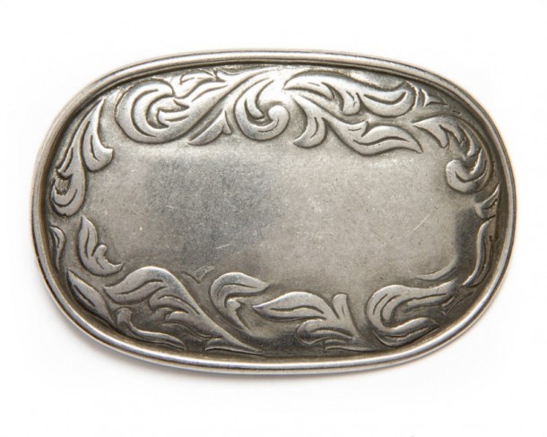 Western style rectangular silver metal belt buckle with engraved filigree scroll