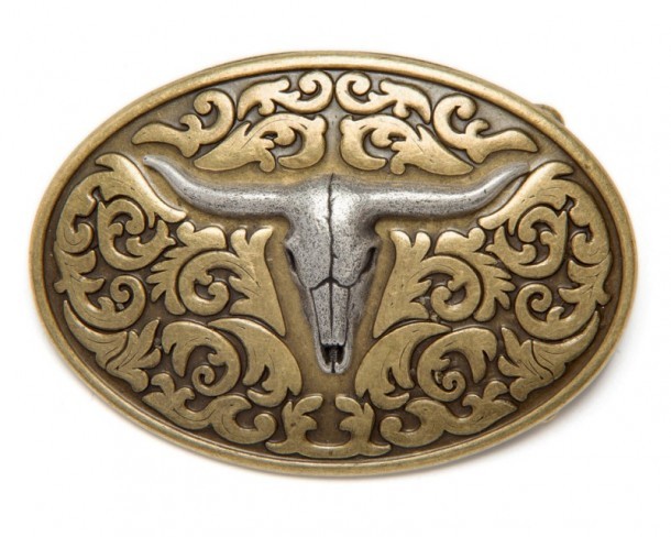Small silver longhorn oval cowboy belt buckle over distressed golden look background