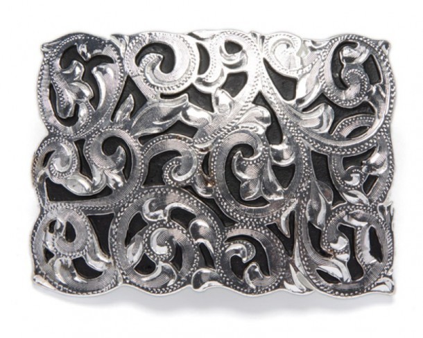Shiny silver look fleur-de-lys over black background rectangular belt buckle