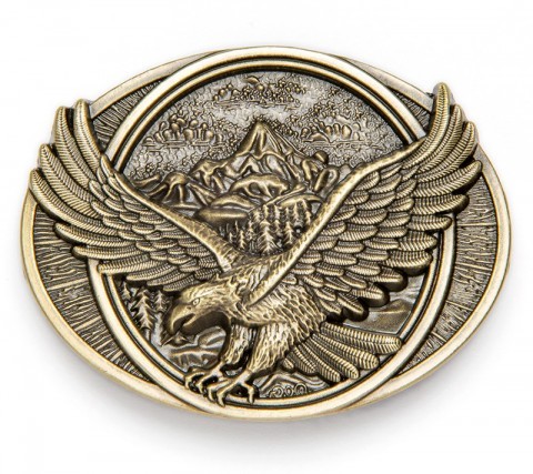 Check now our specialized cowboy Internet site and buy this American style distressed golden belt buckle with an eagle flying over the woods.